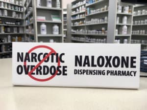 signage at the pharmacy indicating that they dispense Naloxone to prevent narcotic overdose