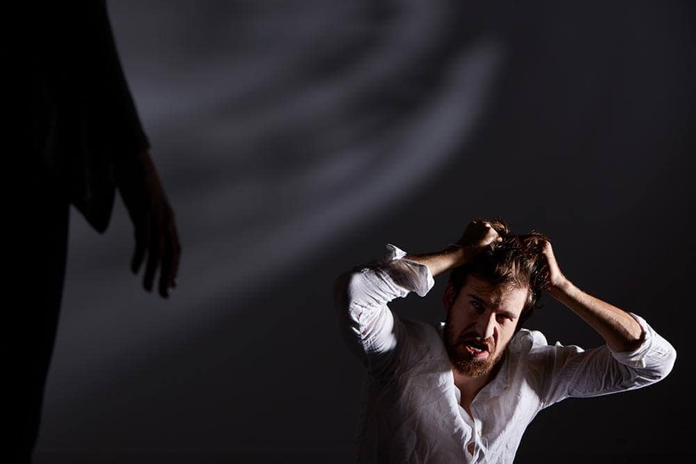 lighthousetreatment-what-is-narcan-or-naloxone-article-photo-terrified-mad-man-having-hallucinations-and-hearing-voices-590256647