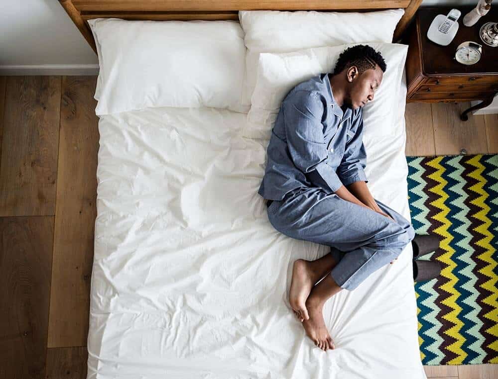 lighthousetreatment-a-complete-history-of-crack-cocaine-article-photo-lonely-man-sleeping-alone-on-the-bed-1017555658