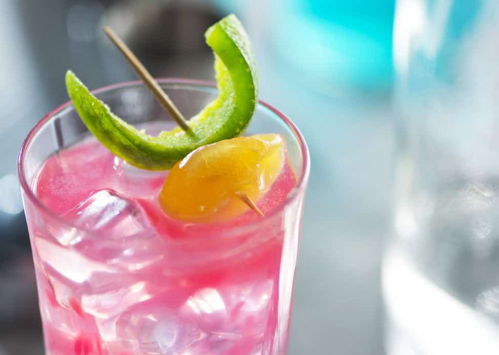 Pink whitney vodka cocktail in a glass.