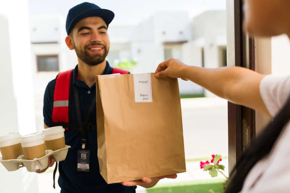 Male recovering from addiction working as a gig worker delivery person