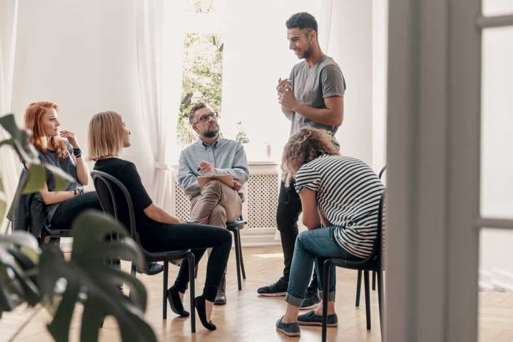 Man working as a peer support staff at a recovery center for drugs and alcohol addiction