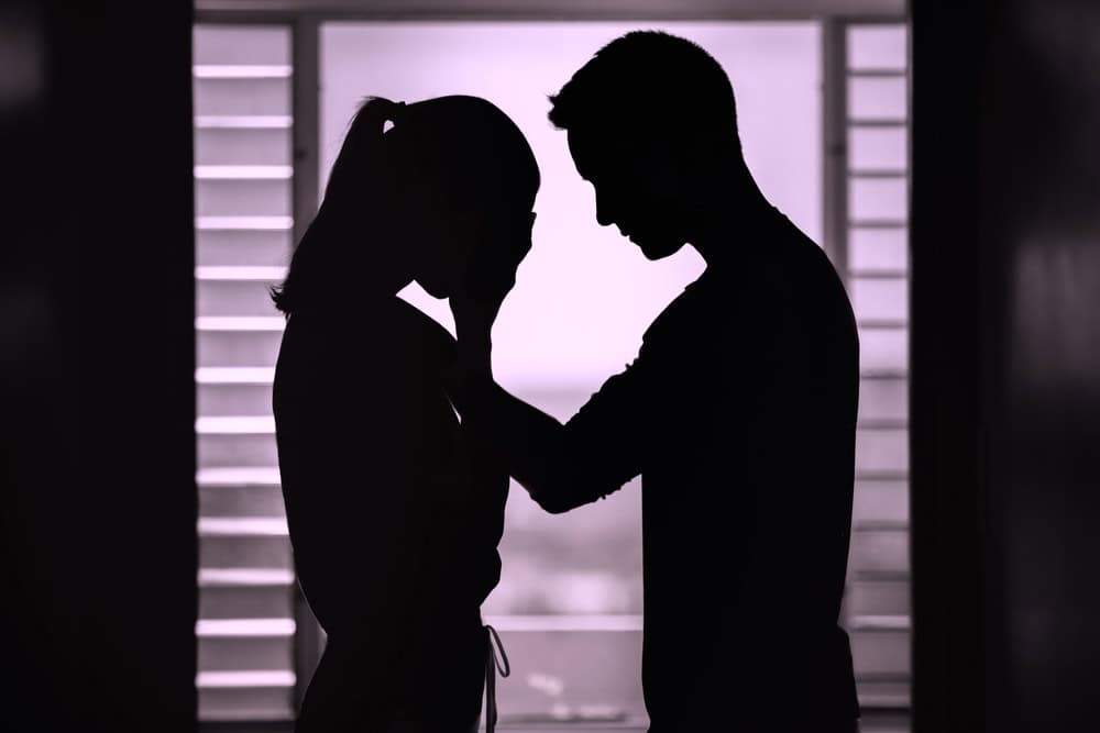 Silhouette of a couple where the female partner is struggling with addiction 