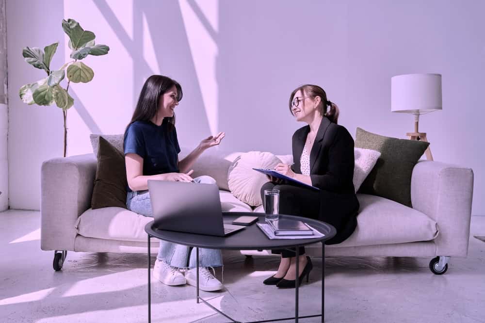 Female consulting a professional addiction therapist after relapse
