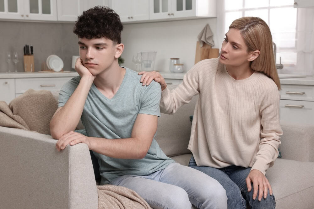Mom talking to her teenager son regarding substance use 