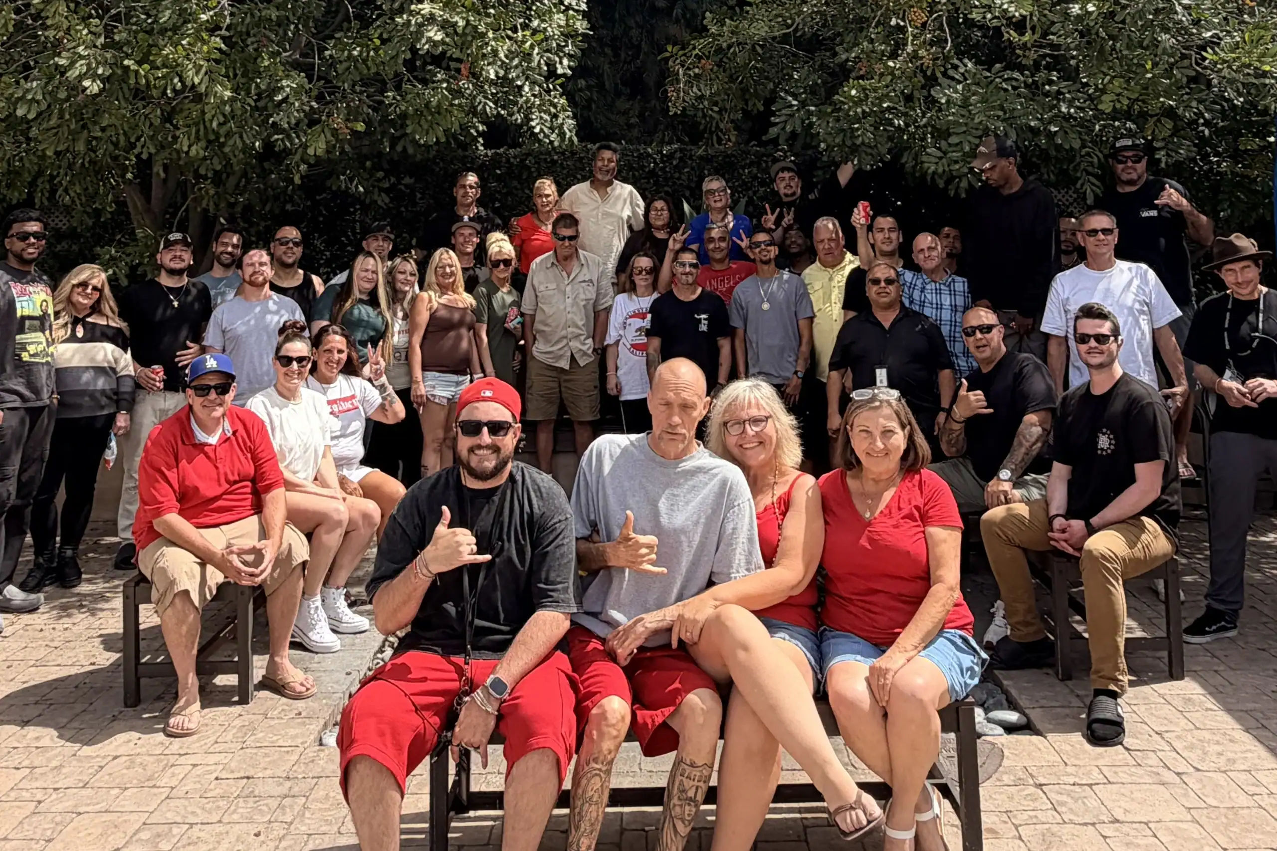 Large group of Lighthouse Orange County rehab alumni at a community gathering